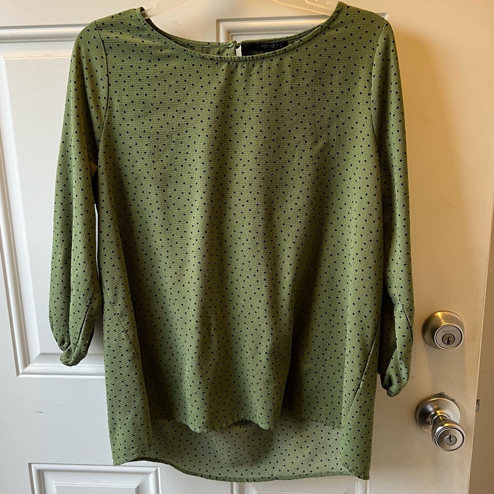 Green and black polka dot top